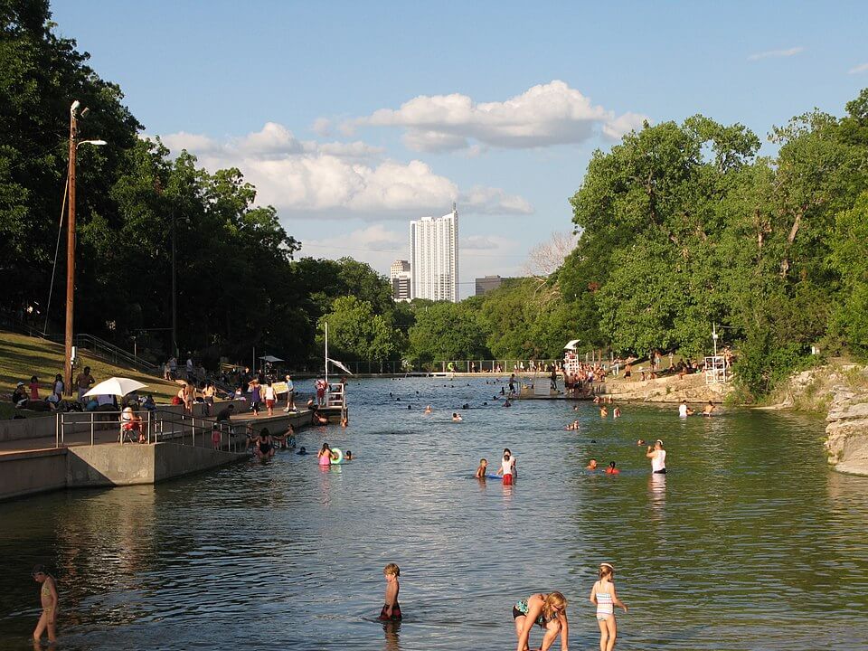 People Beating the heat at Barton Springs pool/ Wikipedia/ https://en.wikipedia.org/wiki/File:360_Barton_Springs_5July08_(9).JPG