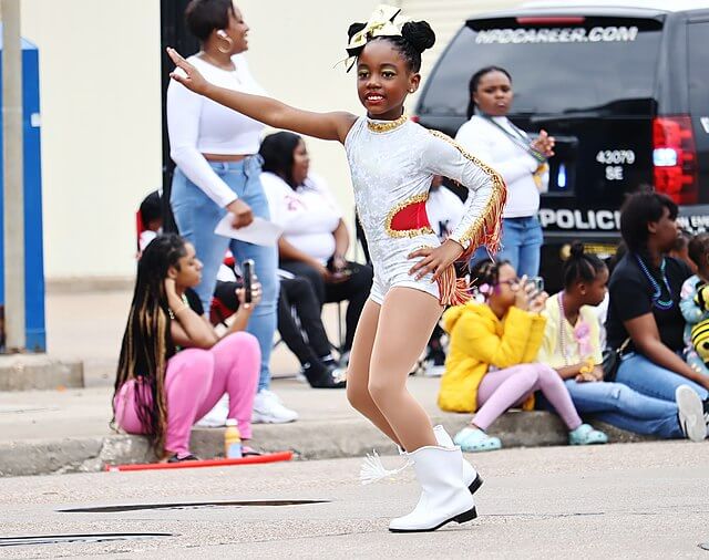 A young girl dancing at the 29th Annual MLK Grande Parade / Wikimedia commons / 2C2K Photography

Link: https://commons.wikimedia.org/w/index.php?search=Martin+Luther+King+Grande+Parade&title=Special:MediaSearch&go=Go&type=image
